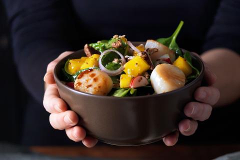 Spring salad topped with scallops