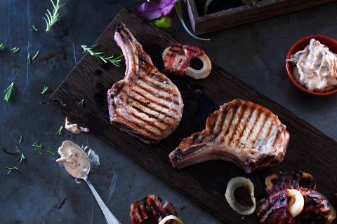 Pork chops with bacon-wrapped onions