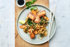 Sesame salmon on a bed of vegetable noodles