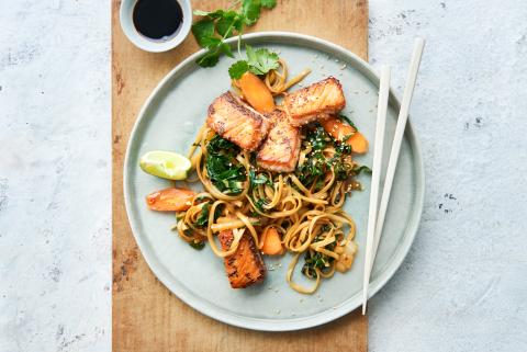 Sesame salmon on a bed of vegetable noodles