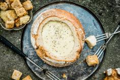 Cheese fondue in a bread bowl