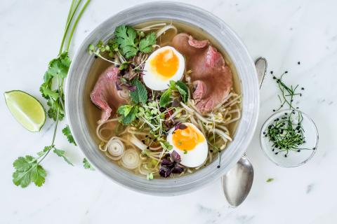 Pho Bo (beef and noodle soup) with micro greens