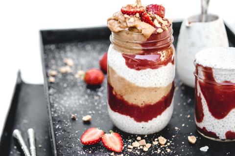 Chia pudding with strawberries, bananas and peanuts