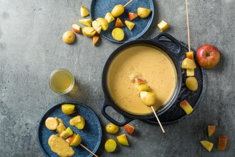 Apple fondue with potato skewers