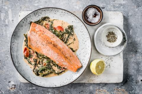 Salmon trout with tomatoes and creamed spinach