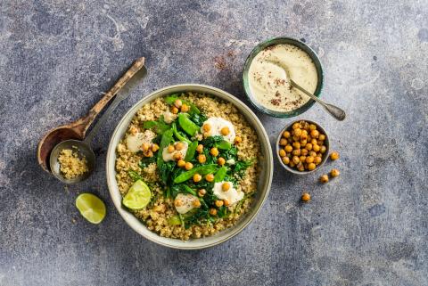 Quinoa salad with winter spinach and hummus
