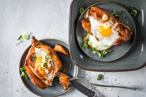 Baked sweet potatoes with fried egg and bacon 