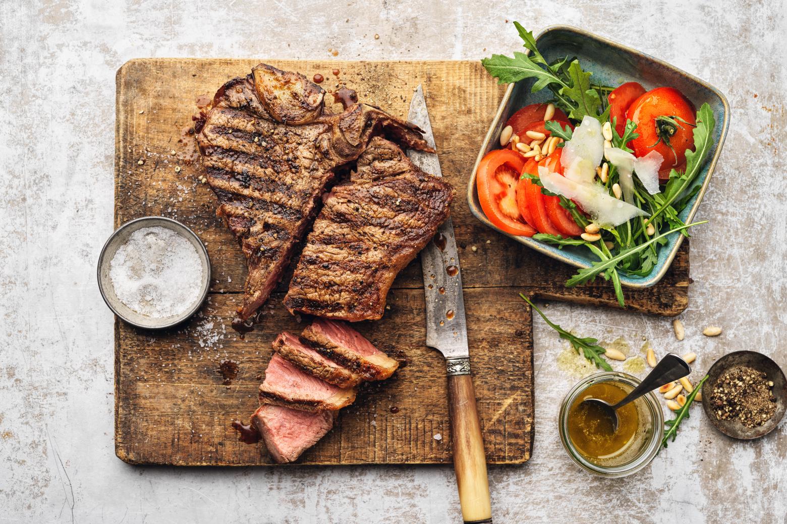 Fiorentina Tbone Steak Cut On Rectangular Wooden Chopping Board