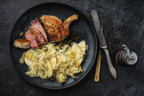 Apple and white cabbage salad with pork chops