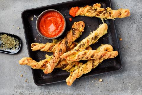 Raclette twists with tomato dip