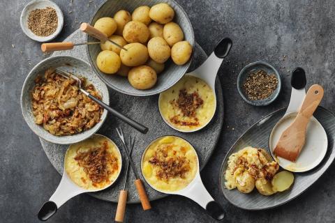 Onion and bacon raclette with caraway seeds