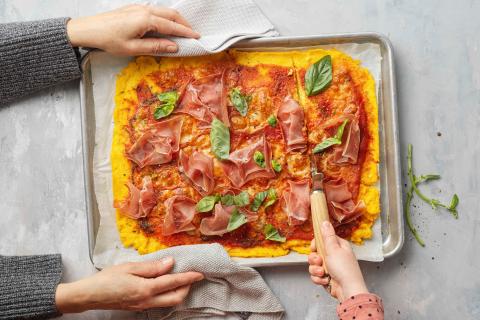 Polenta pizza with cured ham 