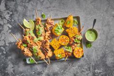 Chicken skewers with corn cobs