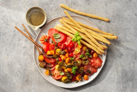 Tomato salad with corn breadsticks