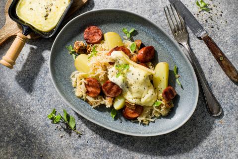 Raclette with sauerkraut and smoked sausages