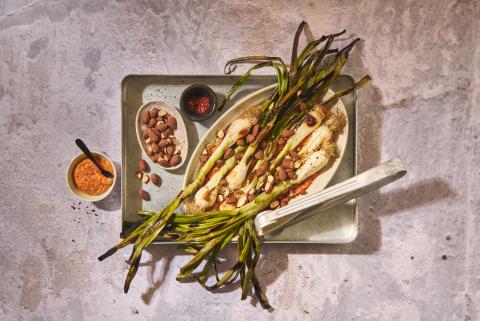Grilled spring onions with romesco sauce