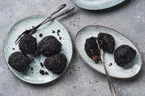 Black rice arancini with buffalo mozzarella and pesto