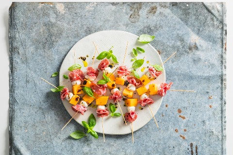 Melon, mozzarella and salami skewers