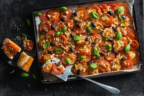 Roasted tomatoes with olives and pine nuts