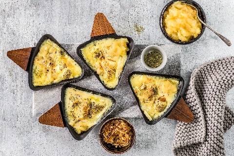Raclette with Alpine herbs and apple sauce