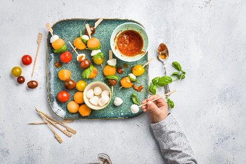 Tomato, mozzarella and melon skewers