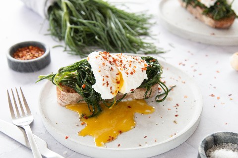 Toast with agretti and poached egg