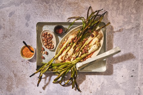 Grilled spring onions with romesco sauce