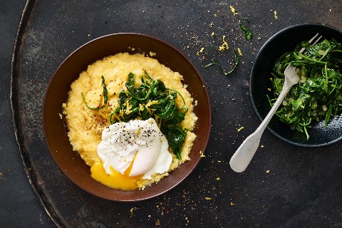 Poached egg on a bed of baby spinach and polenta